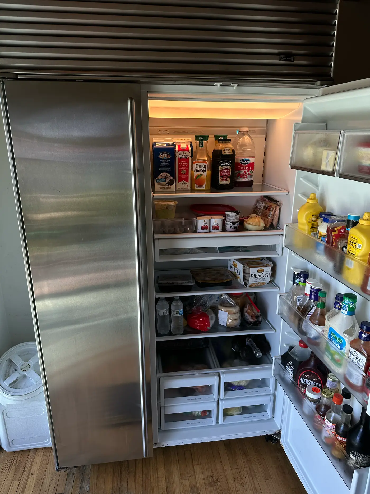 Sub-Zero built-in refrigerator with the door open during a cooling diagnosis