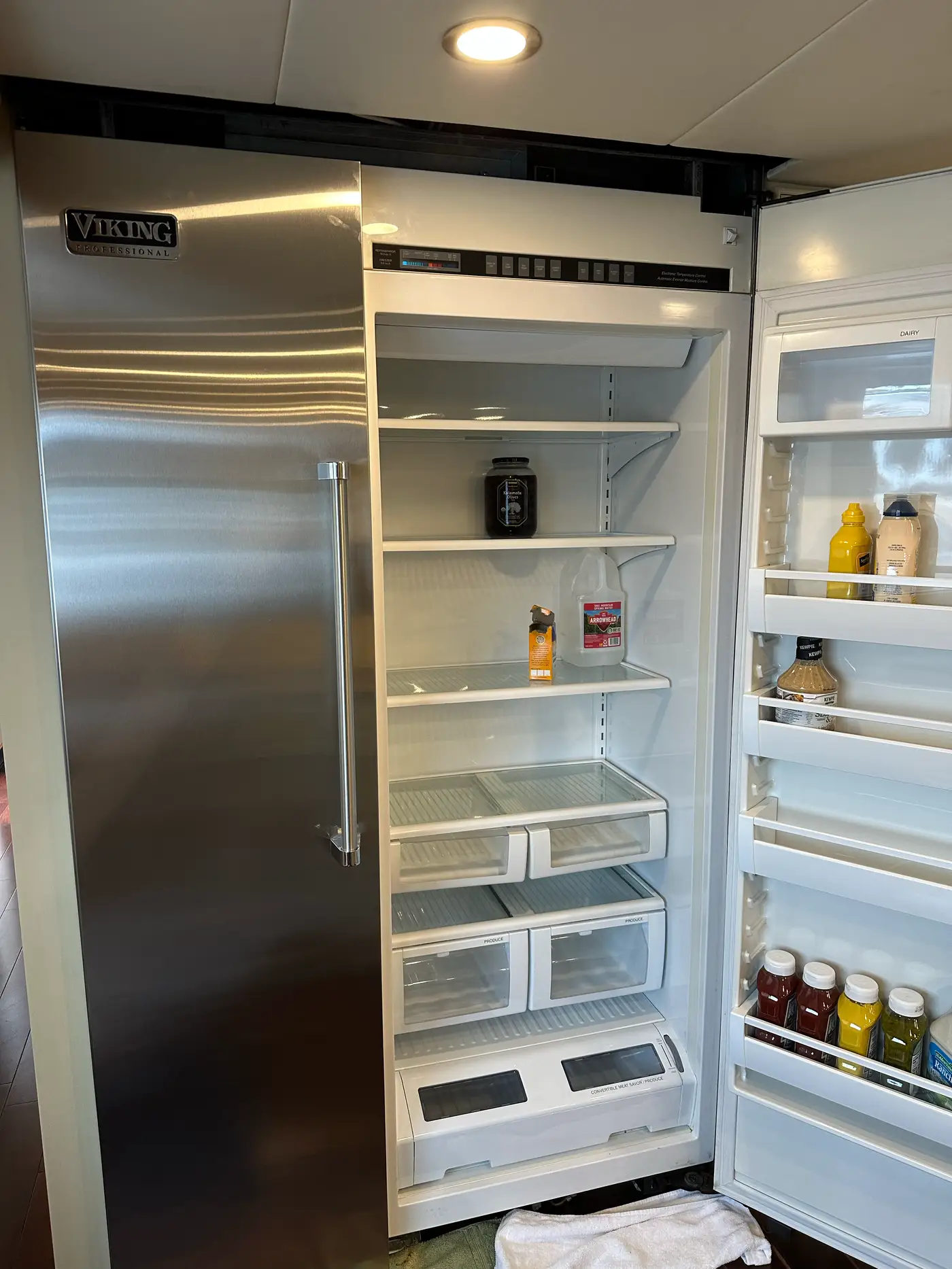Viking Professional built-in refrigerator emptied with door open during a service visit